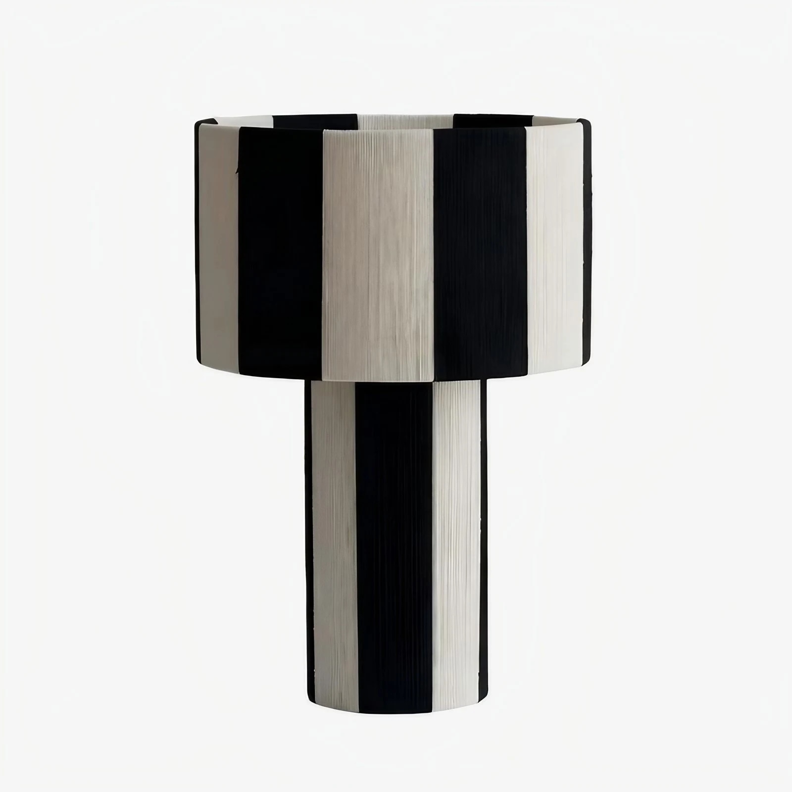 Black and white striped woven shade table lamp on a white background